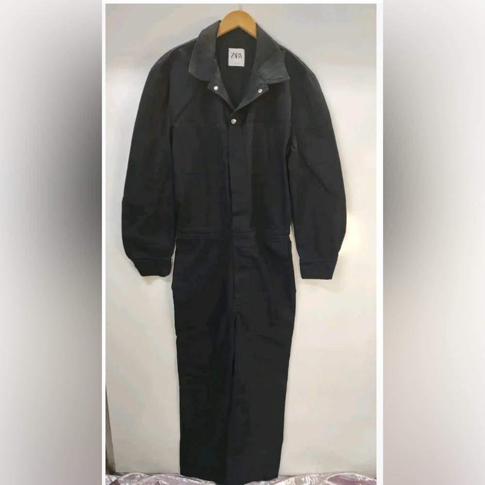 Zara Black Denim Jumpsuit with zipper and button closure.